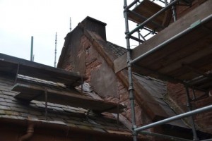 Choir vestry gable reveals faults as cement removed