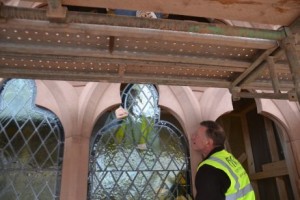 beautiful restored old glass going back into new stone